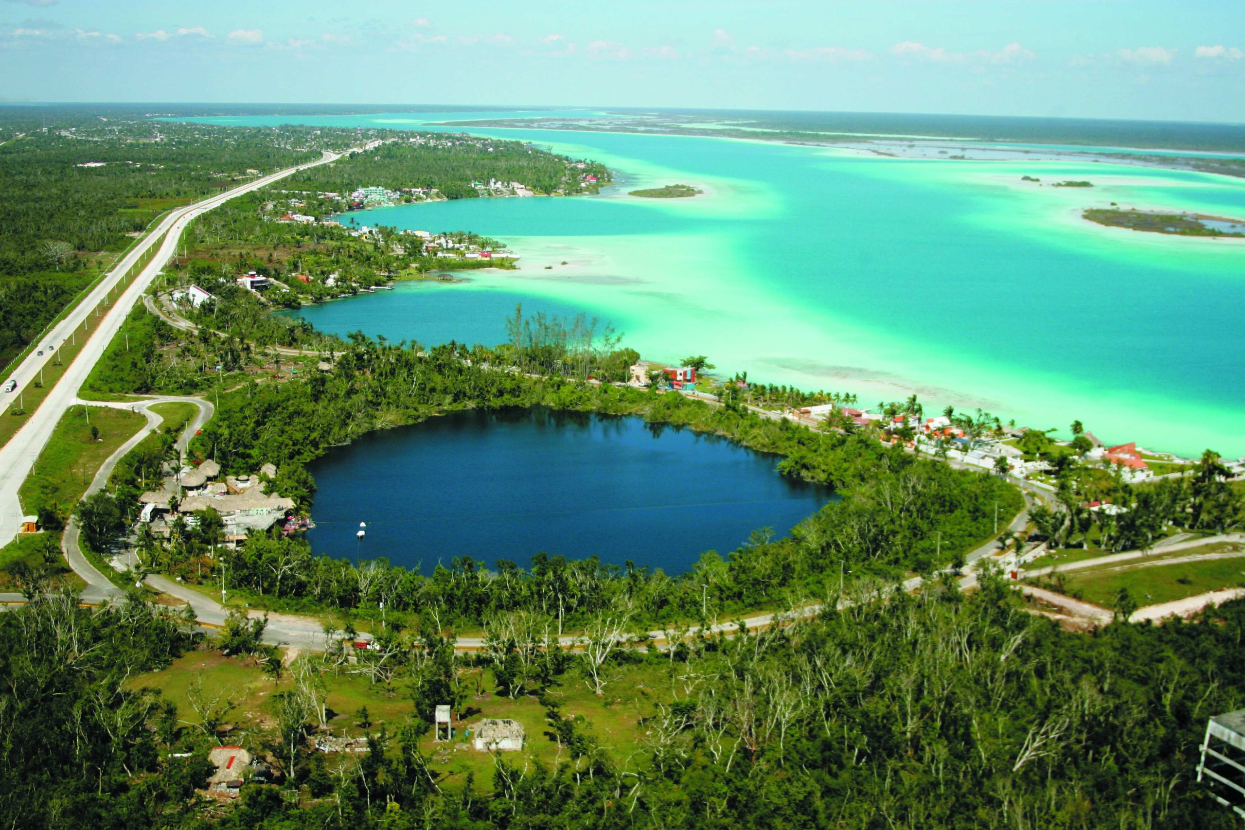 https://cdn.mexicancaribbean.travel/wp-content/uploads/2024/09/Bacalar-CenoteAzul_11zon-1-scaled.jpg