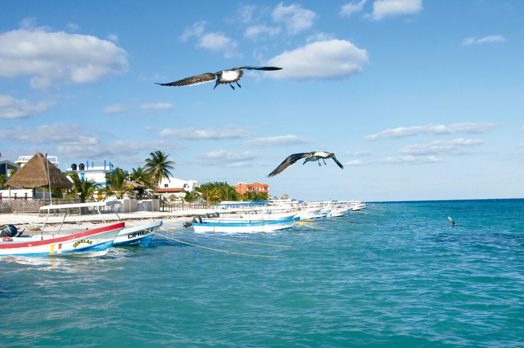 The main beach of Puerto Morelos, with calm water sheltered by the reef