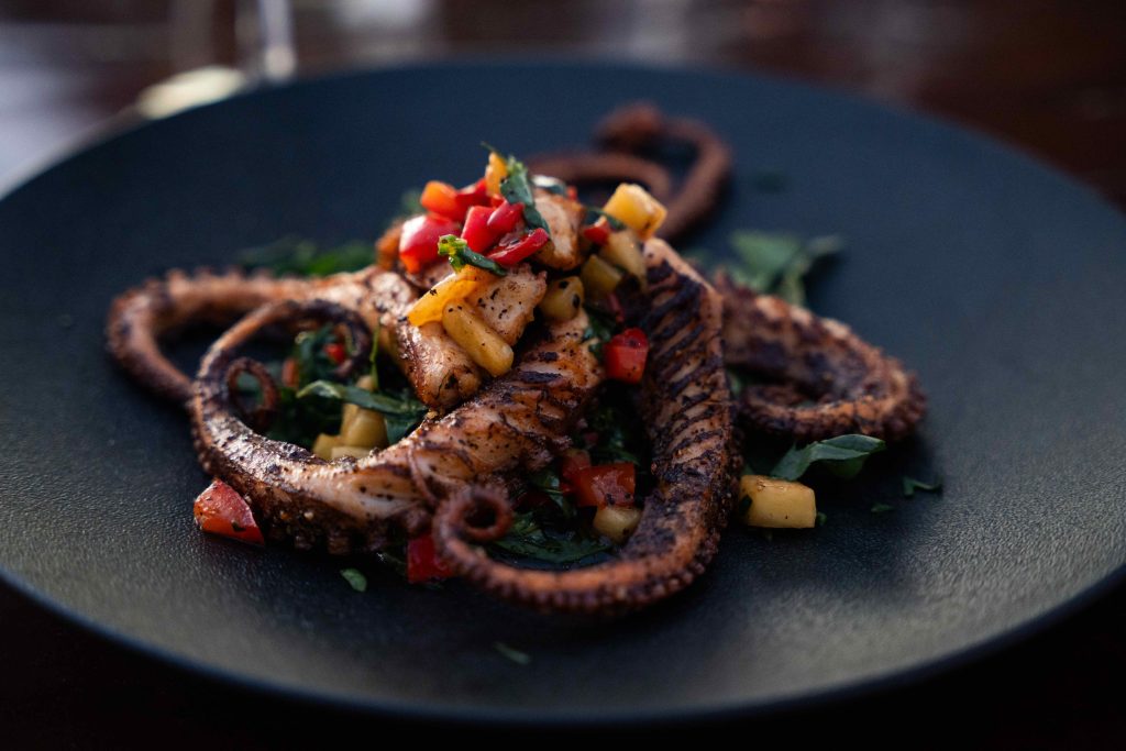 Grilled octopus with mango and pepper salsa