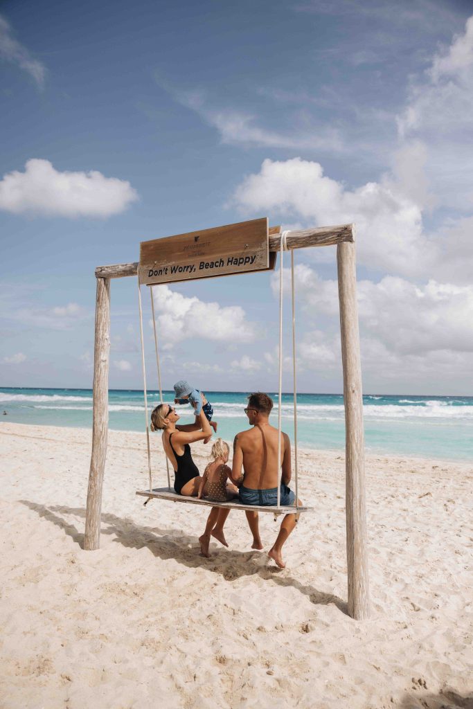 Family enjoying a day by the sea in the Mexican Caribbean