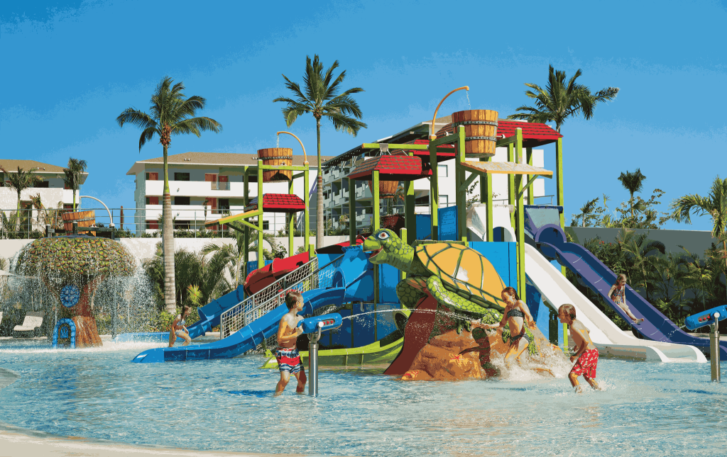 Kids going down the water slides at a Riviera Maya water park